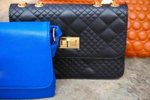 colored handbags closeup photo