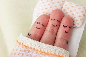 Finger art. Happy man sleeps with two women. photo