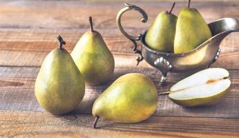 Pears on the wooden background photo