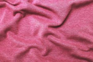 burgundy viva magenta wrinkled plush fabric background texture, soft material pattern photo