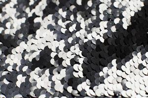 background of silver sequins. shiny sparkling background photo