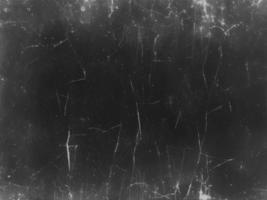 Vintage Black Scratched Grunge Background with Old Film Effect - Abstract Dark Texture for Design and Art - Retro Distressed Weathered Worn Eroded Decay Monochrome Backdrop photo