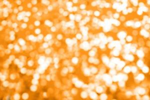 golden sparkles on a purple background. Festive backdrop for your projects. photo