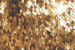 background of gold sequins. shiny sparkling background photo