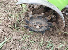 Plowing the land with a cultivator photo