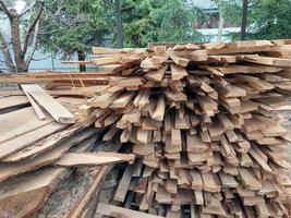 Boards cut into firewood for home heating photo