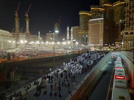 Mecca, Saudi Arabia, April 2023 - Pilgrims from all over the world gather around Masjid al-Haram on the twenty-ninth night of Ramadan in Makkah. photo