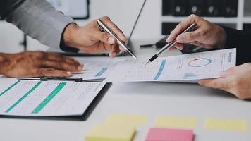 Financial analysts analyze business financial reports on a digital tablet planning investment project during a discussion at a meeting of corporate showing the results of their successful teamwork. video