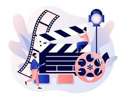 Online cinema concept. Mobile movie theater. Tiny people watching movie with popcorn,3d glasses and video attributes. Cinematography. Modern flat cartoon style. Vector illustration on white background