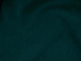 Dark green old velvet fabric texture used as background. Empty green fabric background of soft and smooth textile material. There is space for text.. photo