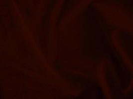 Dark red velvet fabric texture used as background. Empty dark red fabric background of soft and smooth textile material. There is space for text. photo