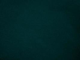 Dark green old velvet fabric texture used as background. Empty green fabric background of soft and smooth textile material. There is space for text.. photo