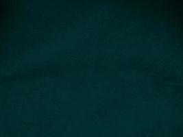 Dark green old velvet fabric texture used as background. Empty green fabric background of soft and smooth textile material. There is space for text.. photo