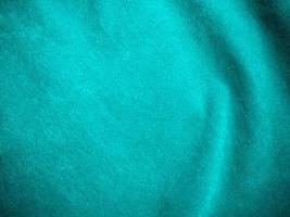 Dark green old velvet fabric texture used as background. Empty green fabric background of soft and smooth textile material. There is space for text.. photo