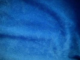 Blue velvet fabric texture used as background. Empty blue fabric background of soft and smooth textile material. There is space for text. photo