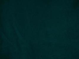 Dark green old velvet fabric texture used as background. Empty green fabric background of soft and smooth textile material. There is space for text.. photo