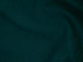 Dark green old velvet fabric texture used as background. Empty green fabric background of soft and smooth textile material. There is space for text.. photo