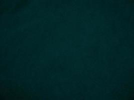 Dark green old velvet fabric texture used as background. Empty green fabric background of soft and smooth textile material. There is space for text.. photo