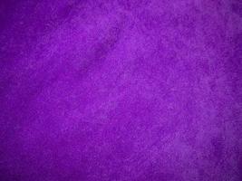 Purple velvet fabric texture used as background. Luxury violet fabric background of soft and smooth textile material. There is space for text. photo
