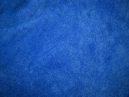 Blue velvet fabric texture used as background. Empty blue fabric background of soft and smooth textile material. There is space for text. photo