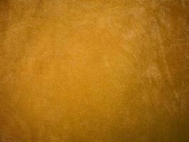Yellow velvet fabric texture used as background. Empty yellow fabric background of soft and smooth textile material. There is space for text. photo