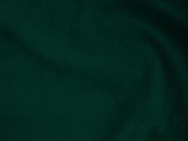 Dark green old velvet fabric texture used as background. Empty green fabric background of soft and smooth textile material. There is space for text.. photo