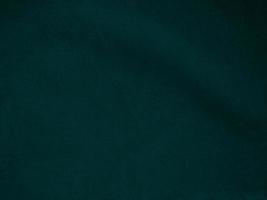 Dark green old velvet fabric texture used as background. Empty green fabric background of soft and smooth textile material. There is space for text.. photo