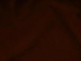 Dark red velvet fabric texture used as background. Empty dark red fabric background of soft and smooth textile material. There is space for text. photo
