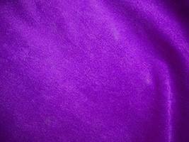 Purple velvet fabric texture used as background. Luxury violet fabric background of soft and smooth textile material. There is space for text. photo