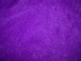 Purple velvet fabric texture used as background. Luxury violet fabric background of soft and smooth textile material. There is space for text. photo