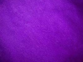 Purple velvet fabric texture used as background. Luxury violet fabric background of soft and smooth textile material. There is space for text. photo