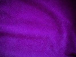 Purple velvet fabric texture used as background. Luxury violet fabric background of soft and smooth textile material. There is space for text. photo