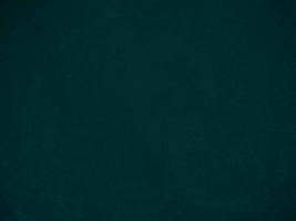 Dark green old velvet fabric texture used as background. Empty green fabric background of soft and smooth textile material. There is space for text.. photo