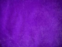 Purple velvet fabric texture used as background. Luxury violet fabric background of soft and smooth textile material. There is space for text. photo