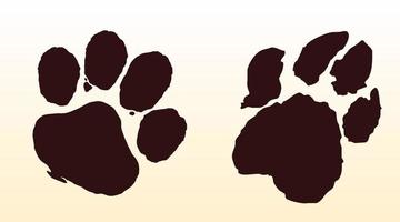 Two silhouettes of a dog and a wolf paw print vector