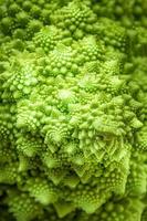 Green vegetables. Detail of Romanesque cauliflower. Healthy food photo