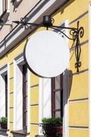 Empty round layout of a street advertising sign on the city facade of a house. photo