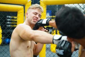 Mixed Martial Art, Power punches into the face of the opponent. Able to defeat opponent by knockout. photo