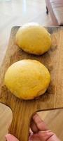 homemade bread made at home with butter on wooden board photo