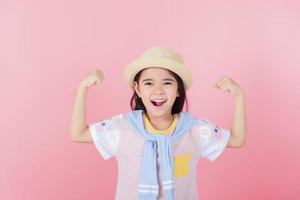 Image of Asian child posing on Pink background photo