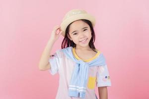 Image of Asian child posing on Pink background photo
