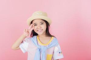 Image of Asian child posing on Pink background photo