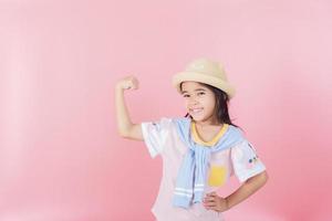 Image of Asian child posing on Pink background photo