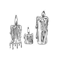 Hand drawn set of burning candles. Vector illustration of a sketch style. Vintage halloween or Christmas drawing.