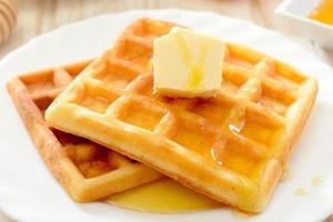 Waffles with honey and butter photo