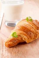 Croissant and yogurt photo