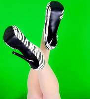 Elegance legs on green background photo