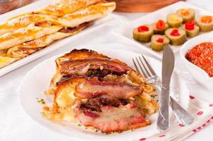 Baked bacon and melting cheese photo