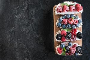Cheese and berries sandwich photo