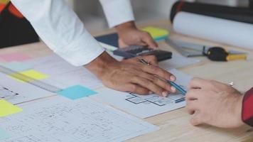 Construction and structure concept of Engineer or architect meeting for project working with partner and engineering tools on model building and blueprint in working site, contract for both companies. video
